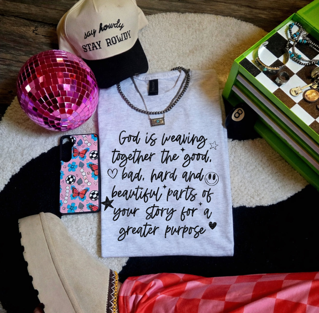God is weaving together the good-graphic tee